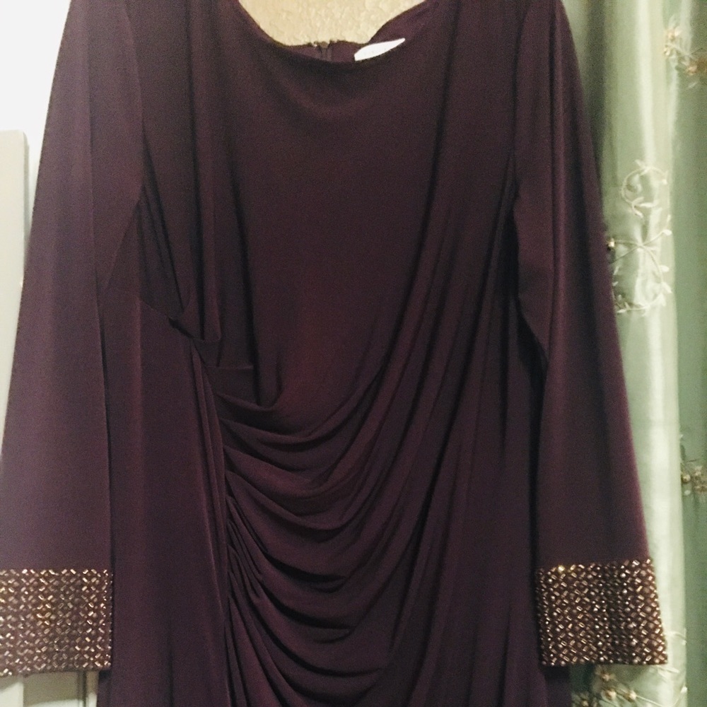 Beautiful eggplant color long formal gown with gold bling cuffs. Size 20W